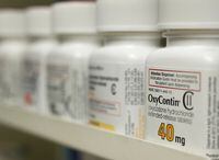 Bottles of prescription painkiller OxyContin sit on a shelf at a local pharmacy, in Provo, Utah, on April 25, 2017.