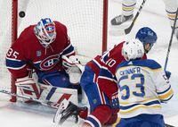Buffalo Sabres' Jeff Skinner (53) scores on Montreal Canadiens goaltender Sam Montembeault (35) as Canadiens' Joel Armia (40) tries to defend during second period NHL hockey action in Montreal on Wednesday, Feb. 21, 2024. THE CANADIAN PRESS/Christinne Muschi