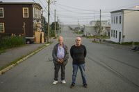Walter (Wally) Gillespie, left, and Robert (Bobby) Mailman pose in the south end neighbourhood where they grew up in Saint John, N.B., Tuesday, Aug. 18, 2020. Nearly a month after two New Brunswick men were acquitted of a murder charge, the province is yet to respond to a request for compensation and an apology. THE CANADIAN PRESS/Darren Calabrese