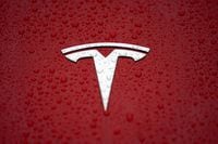 FILE PHOTO: A Tesla logo is seen at the Tesla Shanghai Gigafactory in Shanghai, China January 7, 2019. REUTERS/Aly Song/File Photo