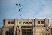 Signage is seen on Manulife Financial Corp.'s office tower in Toronto, on Feb. 11, 2020.
