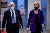 WASHINGTON, DC - AUGUST 10: (L-R) U.S. Senators Ben Cardin (D-MD) and Elizabeth Warren (D-MA) walk through the basement of the U.S. Capitol Building on August 10, 2021 in Washington, DC. The Senate voted 69-30 to pass the $1 trillion infrastructure bill today before moving on to budgetary resolutions. (Photo by Samuel Corum/Getty Images)