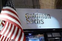 FILE PHOTO: A view of the Goldman Sachs stall on the floor of the New York Stock Exchange July 16, 2013. REUTERS/Brendan McDermid/File Photo