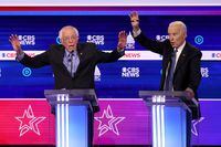 CHARLESTON, SOUTH CAROLINA - FEBRUARY 25: Democratic presidential candidate Sen. Bernie Sanders (I-VT) (L) speaks as former Vice President Joe Biden reacts during the Democratic presidential primary debate at the Charleston Gaillard Center on February 25, 2020 in Charleston, South Carolina. Seven candidates qualified for the debate, hosted by CBS News and Congressional Black Caucus Institute, ahead of South Carolinas primary in four days.  (Photo by Win McNamee/Getty Images)