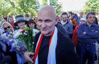 FILE PHOTO: Belarusian human rights activist Ales Byalyatski meets journalists and supporters after being released from prison and arriving at a railway station in Minsk, Belarus, June 21, 2014. REUTERS/Marina Serebryakova/File Photo