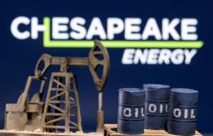 FILE PHOTO: A 3D printed oil barrels and oil pump jack are seen in front of displayed Chesapeake Energy logo in this illustration taken January 25, 2022. REUTERS/Dado Ruvic/Illustration/File Photo