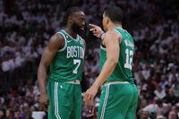 MIAMI, FLORIDA - MAY 23: Jaylen Brown #7 and Grant Williams #12 of the Boston Celtics interact against the Miami Heat during the fourth quarter in game four of the Eastern Conference Finals at Kaseya Center on May 23, 2023 in Miami, Florida. NOTE TO USER: User expressly acknowledges and agrees that, by downloading and or using this photograph, User is consenting to the terms and conditions of the Getty Images License Agreement. (Photo by Megan Briggs/Getty Images)