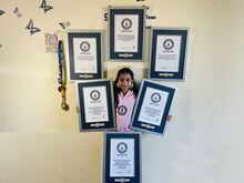 Mamathi Vinoth, 9, is shown with her Guinness world records in an undated handout photo. Vinoth practised hula hooping almost every day after school until bedtime before she spun and hopped her way through three Guinness World Records. THE CANADIAN PRESS/HO-Kadambari Vinoth, *MANDATORY CREDIT*