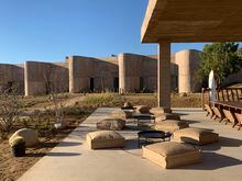 Rising out of its arid site, the Paradero Hotel’s designers disguised its rooms behind an undulating wall of concrete.