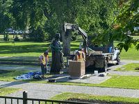 Workers reinstall a statue of Queen Elizabeth that was toppled on Canada Day 2021 on the grounds of the Manitoba legislature in Winnipeg on Friday June 2, 2023. THE CANADIAN PRESS/Steve Lambert