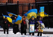 People demonstrate against the war in the Ukraine in front of the Russian embassy in Ottawa on Friday, Feb. 24, 2023. THE CANADIAN PRESS/Sean Kilpatrick