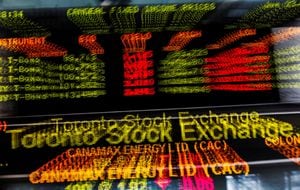 FILE PHOTO: A sign board displaying Toronto Stock Exchange (TSX) stock information is seen in Toronto June 23, 2014. Canada's main stock index was little changed on Monday as weakness in financial and energy shares offset gains in the materials sector. REUTERS/Mark Blinch/File Photo
