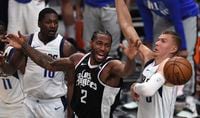 Kawhi Leonard (2) of the LA Clippers loses the ball against the Dallas Mavericks during the second half in Game 5 of an NBA basketball first-round playoff series Wednesday, June 2,  2021, in Los Angeles. (Keith Birmingham/The Orange County Register via AP)