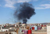 Smoke rises from Syria's Kurdish-controlled northeast city of Qamishli, Syria October 5, 2023. REUTERS/Orhan Qereman