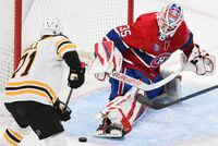 Boston Bruins' Taylor Hall (71) moves in on Montreal Canadiens goaltender Sam Montembeault during second period NHL hockey action in Montreal, Tuesday, January 24, 2023. THE CANADIAN PRESS/Graham Hughes
