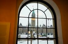 The Peace Tower and Centre Block of Parliament Hill is framed through the window of the Indigenous Peoples Space in Ottawa on Thursday, Jan. 12, 2023. THE CANADIAN PRESS/Sean Kilpatrick