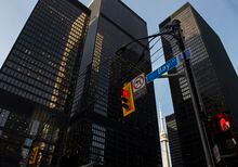 A red light on Bay Street in Canada's financial district is shown in Toronto on Wednesday, March 18, 2020.