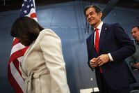 NEWTOWN, PENNSYLVANIA - MAY 11: Pennsylvania U.S. Senate candidates Kathy Barnette and Dr. Mehmet Oz walk off the stage after speaking at a Republican leadership forum at Newtown Athletic Club on May 11, 2022 in Newtown, Pennsylvania. In the May 17 Republican primary to replace retiring Sen. Pat Toomey, Oz, the frontrunner endorsed by former President Donald Trump, leads Barnette, though polls suggest the race is narrowing. A recent Trafalgar Group poll has Oz in front with 24.5 percent of the vote, Barnette in second with 23.2 percent, and former hedge fund CEO Dave McCormick in third with 21.6 percent. (Photo by Michael M. Santiago/Getty Images)