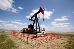 A Canadian Natural Resources pump jack pumps oil out of the ground near Dorothy, Alberta on June 30, 2009