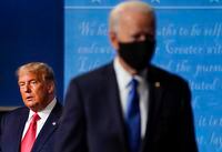 FILE - President Donald Trump, left, remains on stage as then-Democratic presidential candidate former Vice President Joe Biden, right, walks away Thursday, Oct. 22, 2020, at Belmont University in Nashville, Tenn. President Trump's extraordinary effort to overturn Joe Biden's win in Wisconsin returns to the courtroom on Friday, Dec. 11, 2020 with hearings in federal and state lawsuits seeking to invalidate hundreds of thousands of ballots and give the GOP-controlled Legislature the power to name Trump the winner. (AP Photo/Julio Cortez, file)