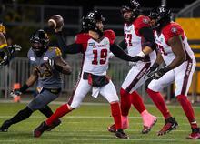 Ottawa Redblacks quarterback Nick Arbuckle (19) prepares to throw during first half CFL football game action against the Hamilton Tiger-Cats in Hamilton, Ont. on Friday, October 21, 2022. THE CANADIAN PRESS/Peter Power