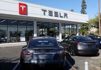 Tesla cars sit parked at a Tesla dealership on October 18, 2023 in Corte Madera, California.