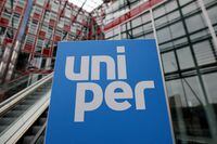 FILE PHOTO: The Uniper logo is seen in front of the utility's firm headquarters in Duesseldorf, Germany, July 8, 2022. REUTERS/Wolfgang Rattay