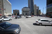 Traffic passes through Winnipeg’s iconic Portage & Main intersection, which has been closed to pedestrians since 1979, on May 1, 2023. SHANNON VANRAES / THE GLOBE AND MAIL