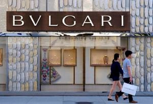 FILE - Shoppers walk past the Italian jewelry and luxury goods store, Bulgari in Beverly Hills, Calif, Thursday April 2, 2015. Italian luxury brand Bulgari is the latest international brand to apologize to China after listing Taiwan as a country on its website. (AP Photo/Richard Vogel, File)