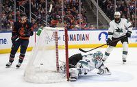 San Jose Sharks' goalie James Reimer (47) is scored on as Edmonton Oilers' Ryan Nugent-Hopkins (93) watches the puck go in the net during overtime NHL action in Edmonton on Thursday, April 28, 2022.THE CANADIAN PRESS/Jason Franson 