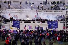 FILE - Insurrectionists loyal to President Donald Trump, storm the Capitol, Wednesday, Jan. 6, 2021, in Washington. Former President Donald Trump can be sued by injured Capitol Police officers and Democratic lawmakers over the Jan. 6, 2021 insurrection at the U.S. Capitol, the Justice Department said Thursday, March 2, 2023, in an ongoing federal court case testing the limits of executive power. (AP Photo/John Minchillo, File)