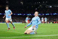 MANCHESTER, ENGLAND - APRIL 11: Erling Haaland of Manchester City celebrates after scoring the team's third goal during the UEFA Champions League quarterfinal first leg match between Manchester City and FC Bayern München at Etihad Stadium on April 11, 2023 in Manchester, England. (Photo by Catherine Ivill/Getty Images)