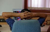 FILE PHOTO: A broker reacts while trading at his computer terminal at a stock brokerage firm in Mumbai, India, February 26, 2016. REUTERS/Shailesh Andrade/File Photo