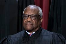 FILE - Associate Justice Clarence Thomas joins other members of the Supreme Court as they pose for a new group portrait, at the Supreme Court building in Washington, Oct. 7, 2022. Thomas has for more than two decades accepted luxury trips nearly every year from Republican megadonor Harlan Crow without reporting them on financial disclosure forms, ProPublica reports. (AP Photo/J. Scott Applewhite, File)