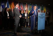 Quebec Health Minister Christian Dube, right, responds to questions as B.C. Health Minister Adrian Dix listens during a news conference with their provincial counterparts after the first of two days of meetings, in Vancouver, on Monday, November 7, 2022. THE CANADIAN PRESS/Darryl Dyck