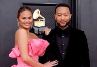FILE – AUGUST 3, 2022: Chrissy Teigen announced via Instagram that she and John Legend are expecting their fourth child. The couple suffered a pregnancy loss of their third child in the Fall of 2020. LAS VEGAS, NEVADA - APRIL 03: (L-R) Chrissy Teigen and John Legend attend the 64th Annual GRAMMY Awards at MGM Grand Garden Arena on April 03, 2022 in Las Vegas, Nevada. (Photo by Frazer Harrison/Getty Images for The Recording Academy)