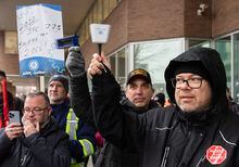 Members of the Public Service Alliance of Canada (PSAC) demonstrate outside the Guy-Favreau federal building in Montreal, Thursday, March 23, 2023, to put pressure on the government of Canada during ongoing labour negotiations. THE CANADIAN PRESS/Graham Hughes 