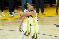 Jun 5, 2022; San Francisco, California, USA; Golden State Warriors guard Jordan Poole (3) and guard Stephen Curry (30) celebrate in the second half against the Boston Celtics during game two of the 2022 NBA Finals at Chase Center. Mandatory Credit: Darren Yamashita-USA TODAY Sports