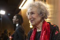 Margaret Atwood and Ian Williams talk to journalists as they arrive on the red carpet for the 2021 Scotiabank Giller Prize, in Toronto, Monday, Nov. 8, 2021. THE CANADIAN PRESS/Chris Young