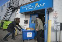 Photo Assignment: 147202 with Slug: "pitching in"Andrea Florian, a real estate agent in Burlington who has run a weekly food drive since the start of the pandemic, drops off donations at the Burlington Food Bank in Burlington, Ont. on Friday January 14,  (J.P. Moczulski/The Globe and Mail)