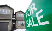 A for sale sign is shown by new homes in Beckwith, Ont., just outside Ottawa, on Wednesday, Jan. 11, 2018. Many investors may have to turn to their parents and grandparents for advice on weathering the current challenge known as stagflation. The last big bout of stagnant growth and high inflation was in the 1970s and early 1980s, a period when double-digit inflation prompted mortgage rates to soar above 20 per cent, unemployment was high and house sales plunged. THE CANADIAN PRESS/Sean Kilpatrick