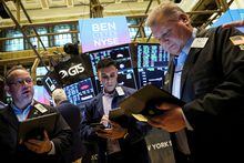 FILE PHOTO: Traders work on the floor of the New York Stock Exchange (NYSE) in New York City, U.S., November 15, 2022. REUTERS/Brendan McDermid