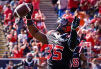 Calgary Stampeders running back Ka'Deem Carey celebrates his touchdown during first half CFL football action against the Edmonton Elks in Calgary, Alta., Monday, Sept. 5, 2022. THE CANADIAN PRESS/Jeff McIntosh
