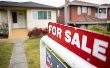 A real estate sign is pictured in Vancouver, B.C., Tuesday, June, 12, 2018.  THE CANADIAN PRESS Jonathan Hayward