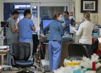 A multidisciplinary tream of doctors, residents and nurses meet at the Halifax Infirmary in Halifax on Friday, Feb. 25, 2022. THE CANADIAN PRESS/Andrew Vaughan