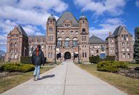 A man walks in front of Queen’s Park in Toronto, Monday, Feb. 20, 2023. THE CANADIAN PRESS/Frank Gunn
