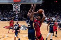Toronto Raptors forward Scottie Barnes (4) goes to the basket against New Orleans Pelicans guard Trey Murphy III (25) in the first half of an NBA basketball game in New Orleans, Wednesday, Nov. 30, 2022. (AP Photo/Gerald Herbert)