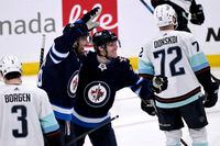 Winnipeg Jets' Blake Wheeler (26) celebrates his goal against the Seattle Kraken with Nikolaj Ehlers (27) during the third period of NHL action in Winnipeg on Sunday May 1, 2022. THE CANADIAN PRESS/Fred Greenslade