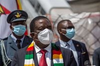 HARARE, ZIMBABWE - MARCH 16: Zimbabwe's President Emmerson Mnangagwa during the arrival of the shipment of Sinovac and Sinopharm vaccines from China at Harare International Airport on March 16, 2021 in Harare, Zimbabwe. Today's shipment is in addition to a batch of 200,000 doses of donated Sinopharm Covid-19 vaccine received last month. Zimbabwe is one of a dozen African countries to receive donated vaccines from China. (Photo by Tafadzwa Ufumeli/Getty Images)
