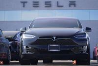 An unsold 2021 Model X sports-utility vehicle sits at a Tesla dealership Sunday, Jan. 24, 2021, in Littleton, Colo.&nbsp;A tax on yachts, luxury cars and private planes and helicopters, designed to hit super-rich, could also cover some electric and hybrid cars, tax experts are warning.&nbsp;THE CANADIAN PRESS AP/David Zalubowski